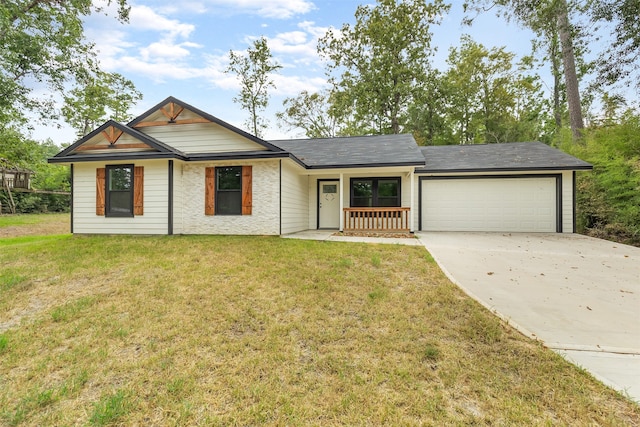 single story home featuring a front lawn and a garage