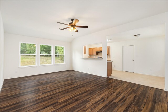 unfurnished living room with ceiling fan and dark hardwood / wood-style floors