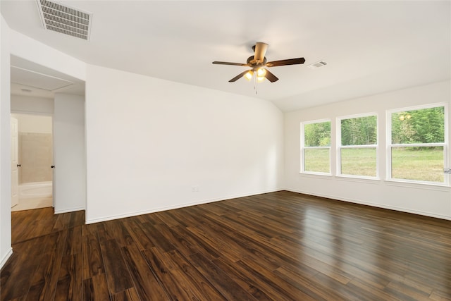 empty room with ceiling fan, lofted ceiling, and dark wood-type flooring