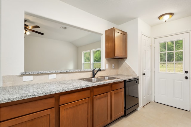 kitchen with backsplash, sink, light tile patterned floors, black dishwasher, and ceiling fan