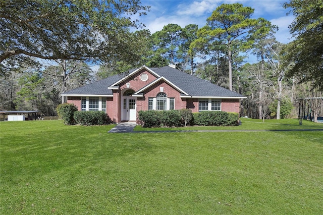 ranch-style home featuring a front lawn