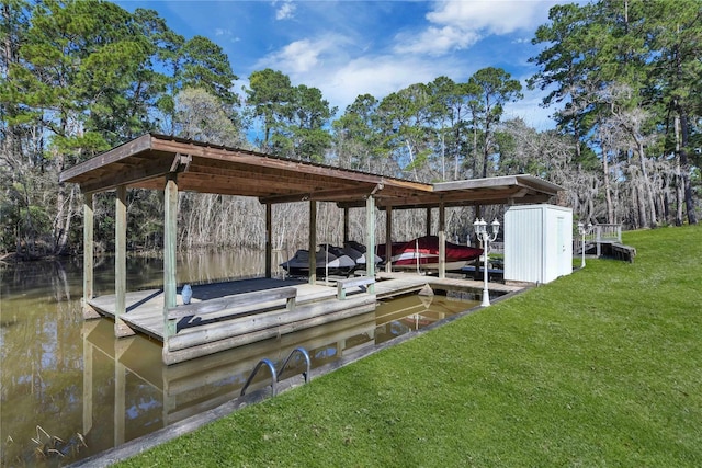 dock area featuring a yard and a water view