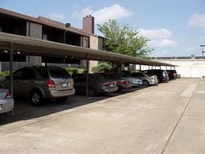 view of parking / parking lot with a carport