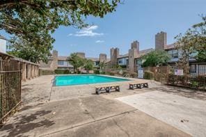 view of swimming pool featuring a patio area