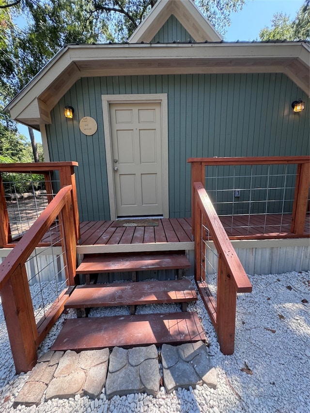 entrance to property featuring a deck