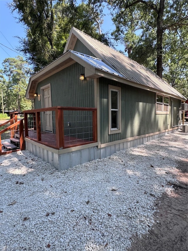 view of property exterior featuring metal roof