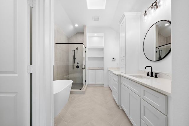 full bathroom with lofted ceiling, visible vents, vanity, a soaking tub, and a stall shower