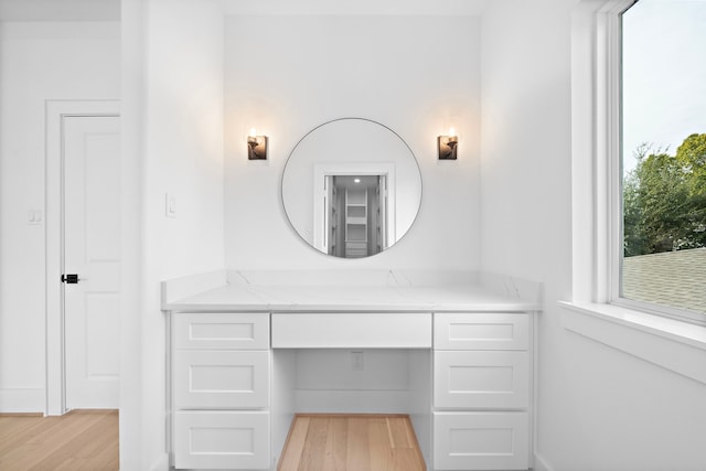 bathroom featuring vanity and hardwood / wood-style floors