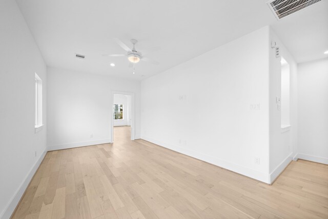 empty room featuring light hardwood / wood-style flooring and ceiling fan