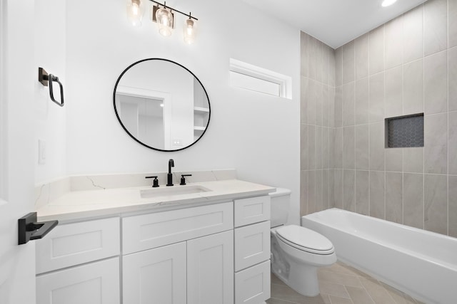 bathroom featuring tile patterned flooring, bathtub / shower combination, vanity, and toilet