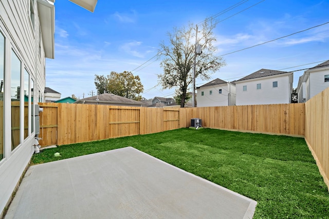 view of yard with a patio area and a fenced backyard