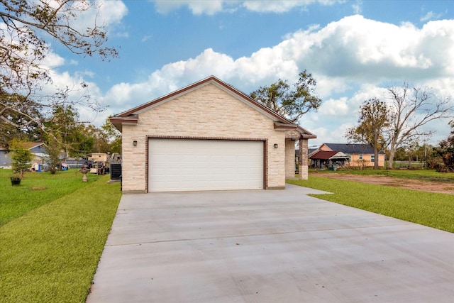 exterior space featuring a garage and a yard