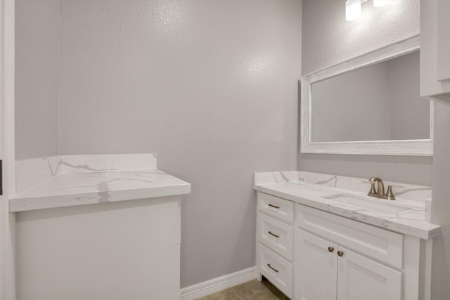 bathroom with tile patterned flooring and vanity