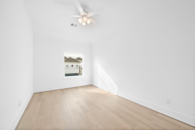 additional living space with light hardwood / wood-style flooring and ceiling fan