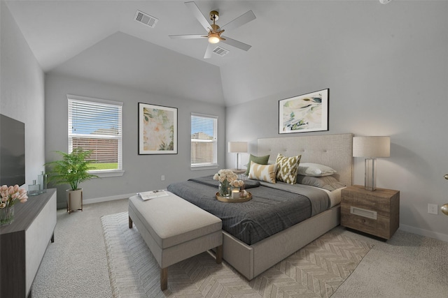 bedroom with ceiling fan, vaulted ceiling, and light carpet