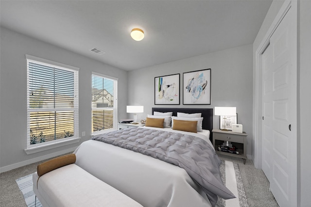 carpeted bedroom featuring a closet