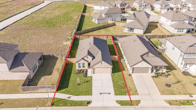 birds eye view of property with a residential view