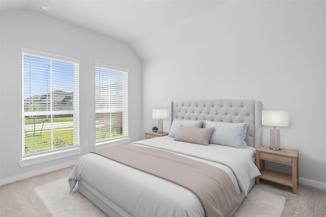 bedroom featuring baseboards, carpet floors, and lofted ceiling