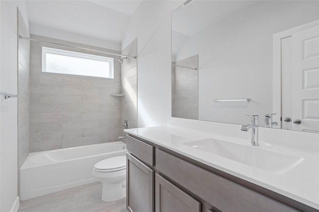 full bathroom featuring wood finished floors, toilet, shower / washtub combination, and vanity