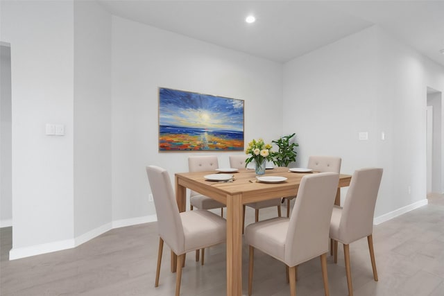 dining room featuring recessed lighting, light wood-style floors, and baseboards