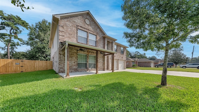 exterior space featuring a front yard and a garage