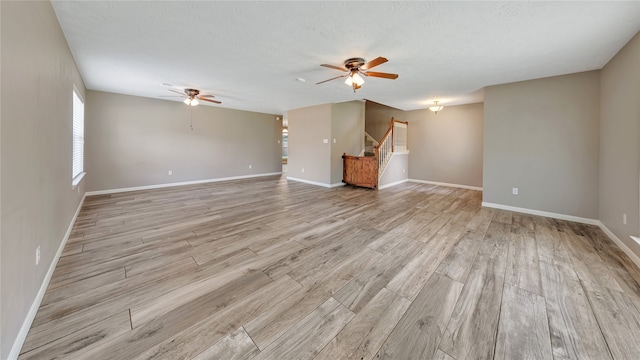 interior space featuring ceiling fan and light wood-type flooring