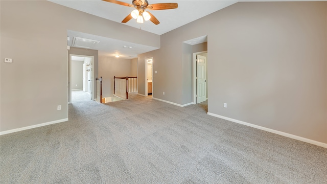 spare room featuring ceiling fan and light carpet