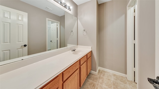 bathroom featuring tile patterned flooring and vanity