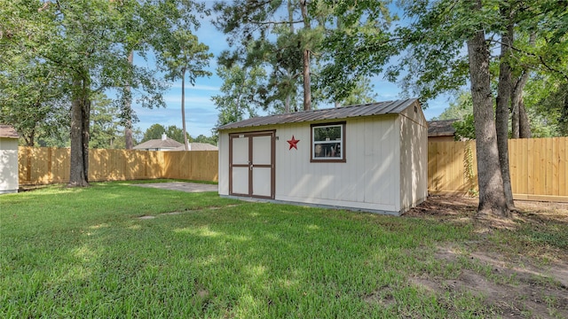 view of outdoor structure with a lawn