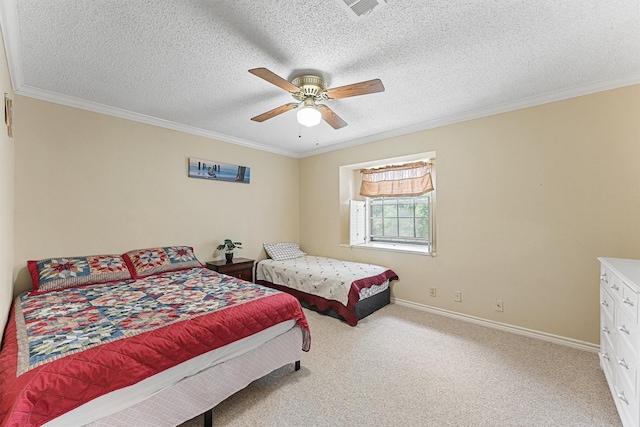 carpeted bedroom with a textured ceiling, ceiling fan, visible vents, baseboards, and ornamental molding