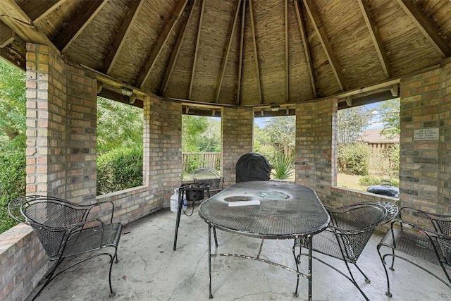 view of patio featuring outdoor dining space and a gazebo