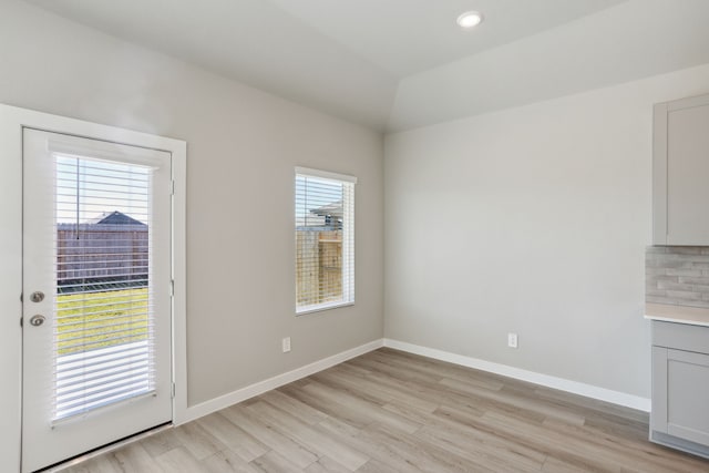 unfurnished dining area with light hardwood / wood-style flooring and a wealth of natural light