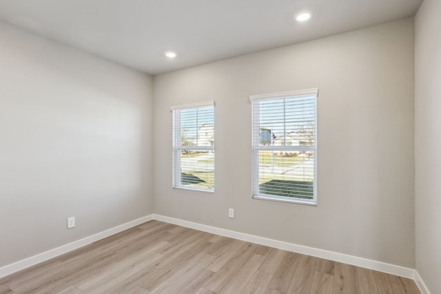 unfurnished room with light hardwood / wood-style floors