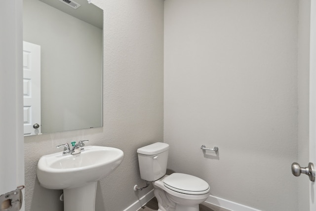 bathroom with toilet and sink