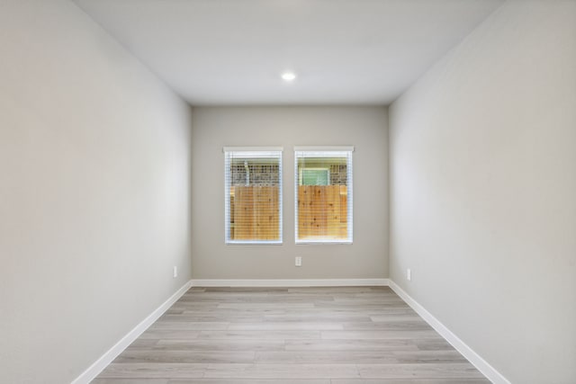 spare room featuring light hardwood / wood-style flooring