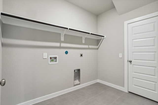 laundry area with light tile patterned flooring, washer hookup, hookup for a gas dryer, and electric dryer hookup