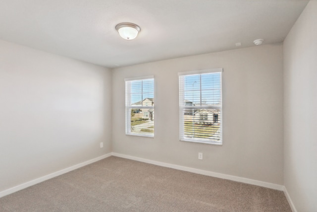 unfurnished room featuring carpet flooring