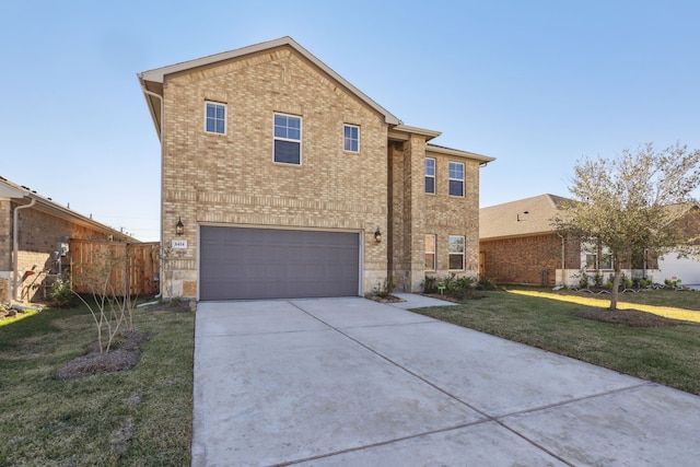 view of front of home featuring a garage and a front lawn