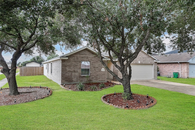 view of front of house with a garage and a front yard