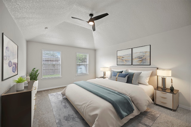 carpeted bedroom with ceiling fan and a textured ceiling