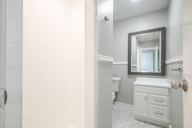 bathroom with vanity, toilet, a shower, and tile patterned floors