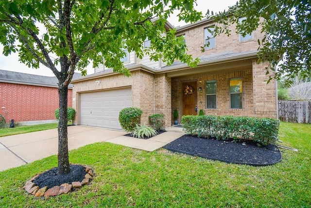 view of front of property with a garage and a front yard