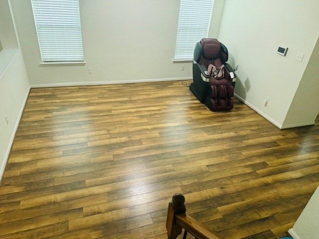 unfurnished room with hardwood / wood-style flooring