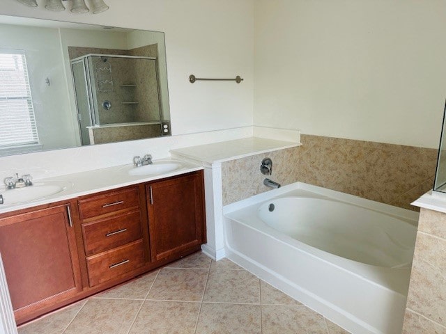 bathroom with vanity, tile patterned floors, and plus walk in shower