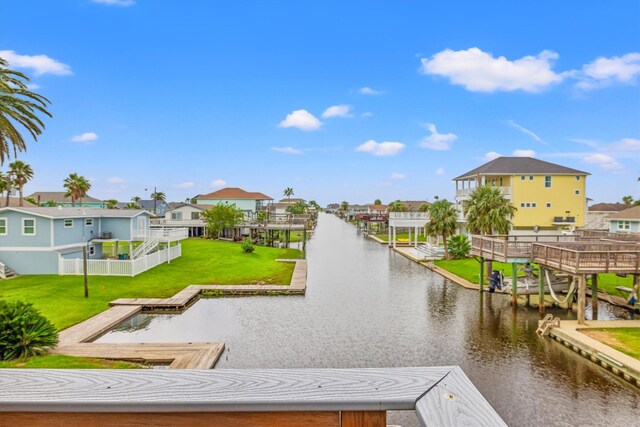 exterior space featuring a water view and a yard