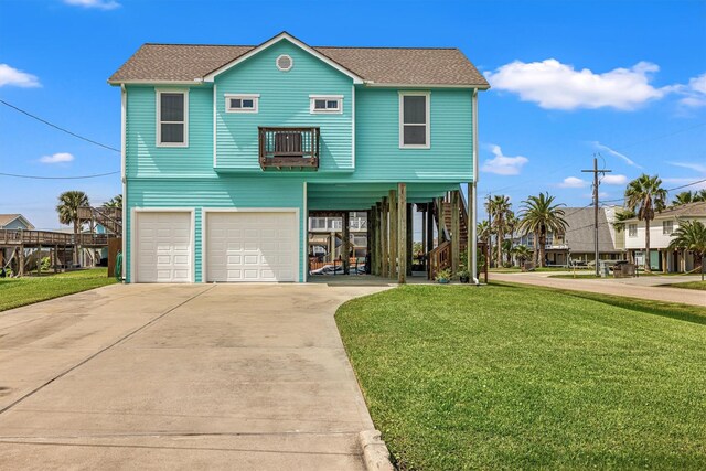 view of front facade featuring a front yard and a garage