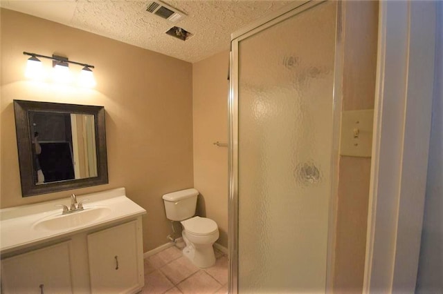 bathroom with toilet, tile patterned floors, an enclosed shower, and vanity