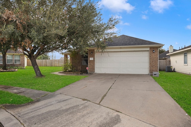 ranch-style home with a front lawn, a garage, and central AC unit