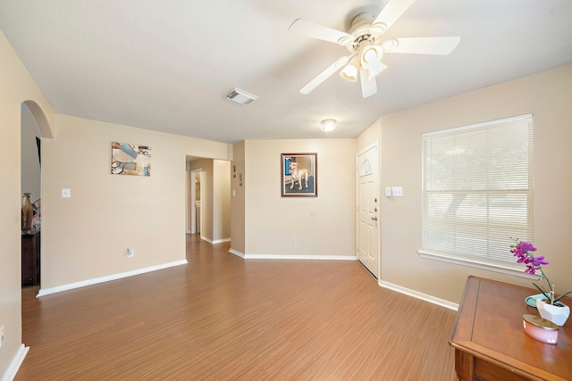 foyer featuring ceiling fan and hardwood / wood-style flooring