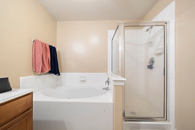 bathroom featuring vanity and plus walk in shower